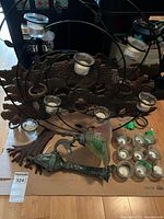 Overview of circular wall candle holder, wall sconce, and spare glass cups