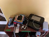 Overall lot with Wii U console, GamePad, controllers, games and cables