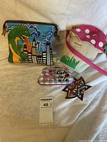 Overview of all three items: mushroom bag, dragon pouch, coin purse