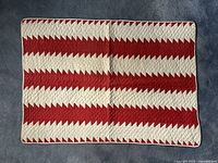 Full top view of red and white zigzag stripe pattern