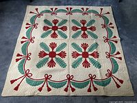 Full view of quilt laid flat showing overall pattern and condition