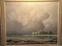 Full frontal view of oil on canvas landscape painting featuring expansive cloudscape and shoreline reflection, mounted in ornate gilt wood frame