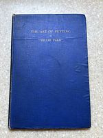 Front cover of blue cloth hardcover book with gold-stamped title