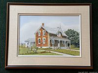 Full view of the framed watercolour painting showing the entire farmhouse scene, mat and frame.