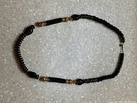 Full view of the necklace arranged in a circle to show length and bead style.