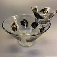 Large and small leaf-pattern glass bowls with metal bracket assembled
