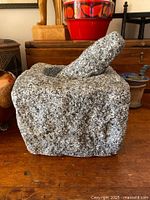 Mortar with pestle resting inside