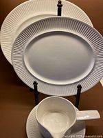 Front view of both platters, gravy boat and saucer