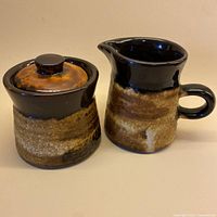 Sugar bowl with lid and creamer pitcher showing full set