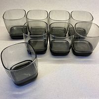 All eight smoky grey square lowball glasses front view