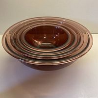 Set of four nested amethyst Pyrex bowls
