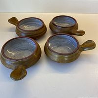 All four stoneware handled bowls top view