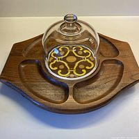 Top view of wood board with glass dome on tile insert
