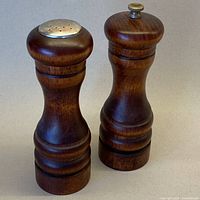 Salt shaker and pepper grinder front view