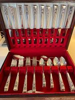 Open case showing full flatware set