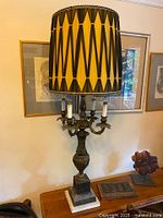 Full view of brass and marble lamp with shade