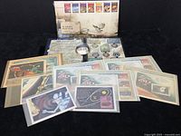 Full lot overview showing 10 pieces including the Harry Potter First Day Cover and multiple commemorative stamp cards.