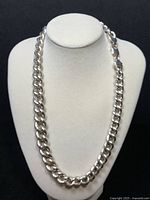 Full view of the 18 inch curb chain necklace displayed on a white bust form showing the polished silver curb links.