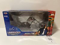 Front view of the boxed American Chopper Black Widow model bike showing the bike through clear plastic window with box artwork and branding.