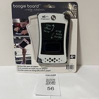 Front of packaged Boogie Board showing product and branding with child using board on packaging photo.