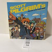 Front view of Scott Pilgrim's Precious Little Card Game box showing artwork and title