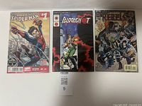 Four comic books displayed, including Amazing Spider-Man #1, Bloodshot, R.E.B.E.L.S. '94, and The Amazing Superman with vivid covers.