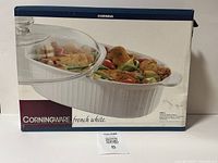 Box front view of Corningware French White 4-quart covered oval casserole dish showing branding and product image