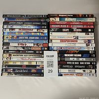 Top view of the stacked DVD cases showing all titles in the lot for sale.