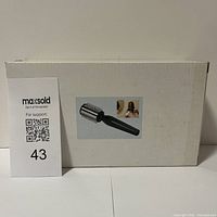 Photo of the product box front showing the product image and name.