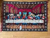Full view of The Last Supper rug laid on wooden floor showing complete art and border.