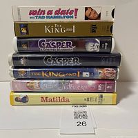 Stack of 7 VHS tapes showing spine titles: Win a Date with Tad Hamilton, The King and I, Casper: A Spirited Beginning, Casper, The King and I, Barbie in The Nutcracker, Matilda