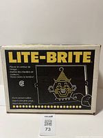 Front side of the original Lite-Brite box showing title and sample image outline of a clown made from pegs
