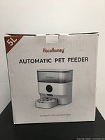Photo of the unopened box labeled HocoHomey Automatic Pet Feeder 5L capacity