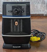 Front view of Honeywell HZ-370BP Easy-Glide digital ceramic heater showing LED display, control dial, and mesh front grille.