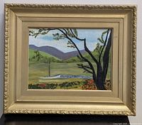 Frontal photo of the vintage framed nature landscape painting showing full image and frame.