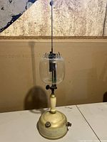 Full view of the Coleman 157 lantern showing glass globe, valve, and base