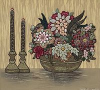 Close-up of mixed media flower and candle artwork showing detailed ceramic and stone flower texture.