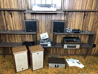 Multiple Sony audio components arranged on shelves and floor
