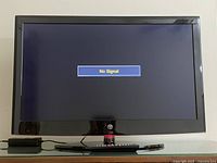Front view of the 32-inch Westinghouse flat screen television powered on showing 'No Signal' message.