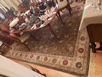 Full view of rug under dining table showing overall pattern and scale