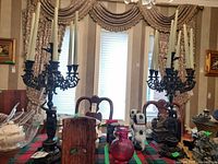 Full lot overview showing two candelabras with candles on table