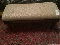 Top view of the bench showing the upholstered seat with visible wear.