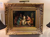 Full front view of framed print and mounted picture light on wall