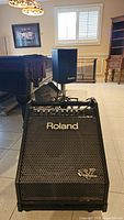 Front view of Roland PM-30 amplifier cabinet with satellite speaker mounted
