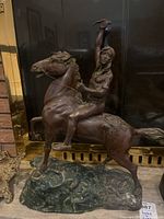 Front view of sculpture showing rider and rearing horse