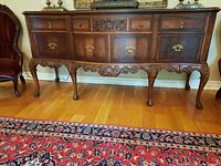 Front view showing four drawers and two cabinet doors