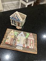 Ceramic Creole cottage planter with detailed architecture and color accents