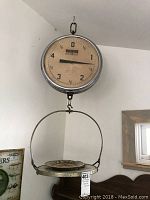 Full view of the vintage Detecto Matic hanging scale with dial and hanging platform showing overall condition.