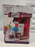 Front view of the sealed factory box showing the snow cone maker image and vintage styling.