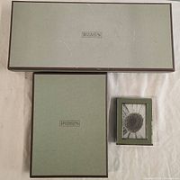 Five Restoration Hardware frames including two boxes and frames with photos
